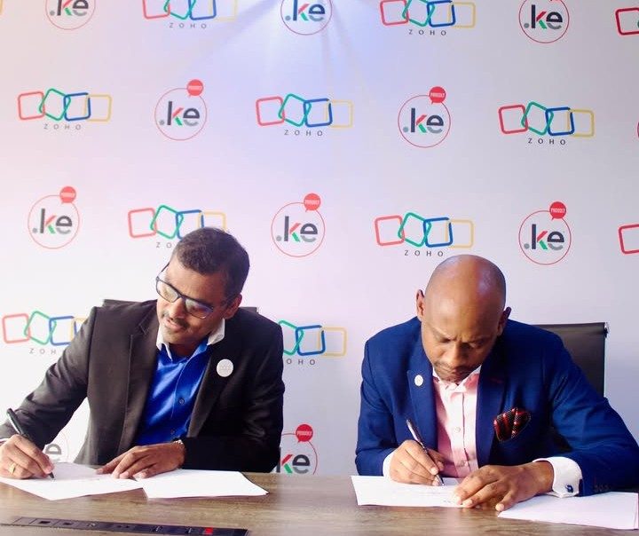 Zoho Regional Managing Director for East Africa, Mr. Veerakumar Natarajan and KeNIC CEO, Mr. Andrew Mwanyota, signing the partnership that provides KeNIC customers with free ZOHO wallet credits.