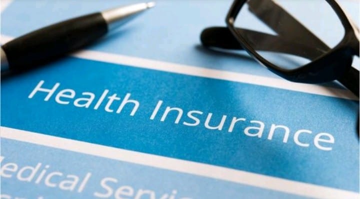 Image of health insurance with a pen