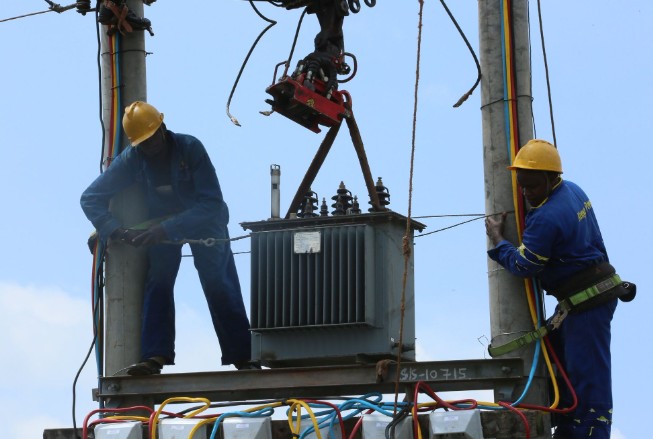 Image of KPLC technicians fixing a transformer